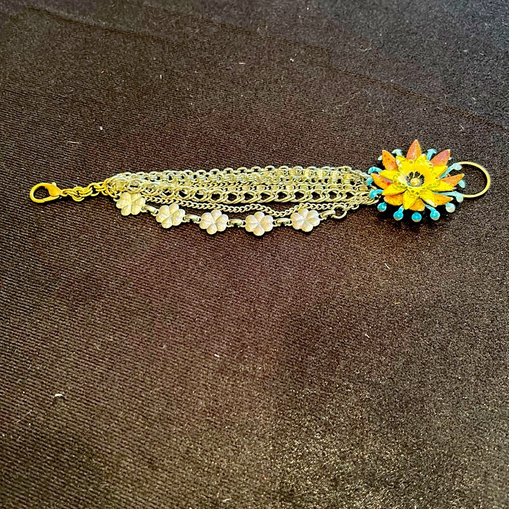 Vintage inspired mixed media bracelet featuring enamel flower